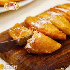 Candy brand candy stuffed frozen Katayef with peanuts, raisins, and coconut, ready-to-cook Middle Eastern vegetarian dessert.
