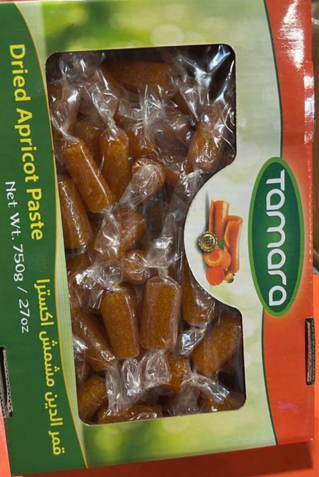 Tamara dried apricot paste rolls in 750g, individually wrapped snacks with vibrant apricot color and textured surface.