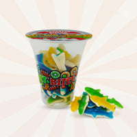 Assorted shark-shaped fruit bites in a 6oz cup by Fun Fruit Bites, featuring colorful candy pieces.