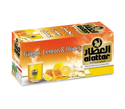 AlAttar Ginger Lemon & Honey Tea in a clear glass mug, showing the herbal infusion with slices of lemon and ginger.