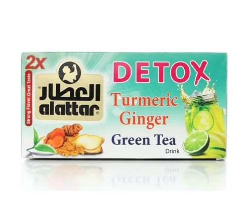 AlAttar Detox Turmeric Ginger Green Tea 2-pack featuring two boxes with tea bags and vibrant turmeric, ginger, and green tea imagery.