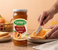 Tamara Country Style Apricot Jam 430g jar with apricots and spread, showcasing the gourmet fruit jam's rich texture and vibrant color.
